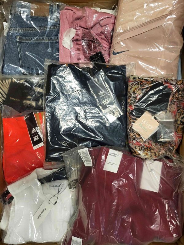 The photo shows a package with clothing in the category AW.