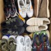 The photo shows a package with footwear in the category SH.