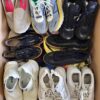 The photo shows a package with footwear in the category SH.
