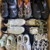 The photo shows a package with footwear in the category SH.