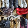 The photo shows a package with footwear in the category SH.