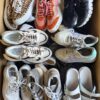 The photo shows a package with footwear in the category SH.