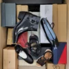 The photo shows a package with footwear in the category AS.