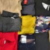 The photo shows a package with clothing in the category U.