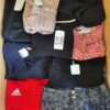 The photo shows a package with clothing in the category U.