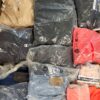 The photo shows a package with clothing in the category D.