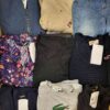 The photo shows a package with clothing in the category U.