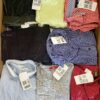 The photo shows a package with clothing in the category U.