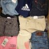 The photo shows a package with clothing in the category U.