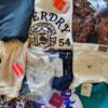 The photo shows a package with clothing in the category T.