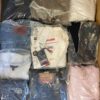 The photo shows a package with clothing in the category D.
