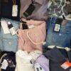 The photo shows a package with clothing in the category T.