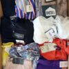 The photo shows a package with clothing in the category T.