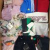 The photo shows a package with clothing in the category T.