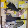 The photo shows a package with footwear in the category SM.