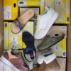 The photo shows a package with footwear in the category SM.