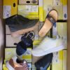 The photo shows a package with footwear in the category SM.
