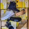 The photo shows a package with footwear in the category SM.