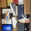 The photo shows a package with footwear in the category BS.