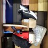 The photo shows a package with footwear in the category BS.