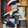 The photo shows a package with footwear in the category BS.