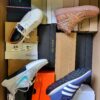 The photo shows a package with footwear in the category BS.