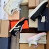 The photo shows a package with footwear in the category BS.