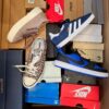 The photo shows a package with footwear in the category BS.