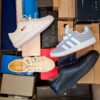 The photo shows a package with footwear in the category BS.