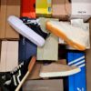 The photo shows a package with footwear in the category BS.
