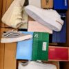 The photo shows a package with footwear in the category BS.