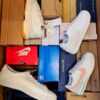 The photo shows a package with footwear in the category BS.