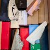 The photo shows a package with footwear in the category BS.