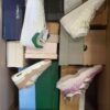The photo shows a package with footwear in the category BS.