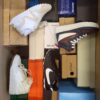 The photo shows a package with footwear in the category BS.