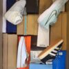 The photo shows a package with footwear in the category BS.