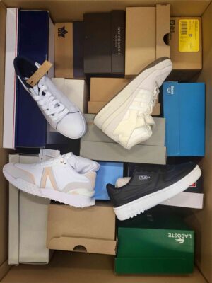 The photo shows a package with footwear in the category BS.