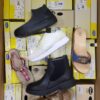The photo shows a package with footwear in the category SM.