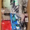 The photo shows a package with clothing in the category AU.