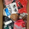 The photo shows a package with clothing in the category AU.