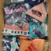 The photo shows a package with clothing in the category AU.