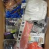 The photo shows a package with clothing in the category AU.