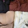 The photo shows a package with clothing in the category TJ.