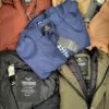 The photo shows a package with clothing in the category TJ.