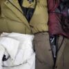 The photo shows a package with clothing in the category TJ.