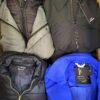 The photo shows a package with clothing in the category TJ.