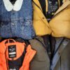 The photo shows a package with clothing in the category TJ.