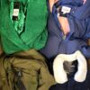 The photo shows a package with clothing in the category TJ.