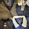 The photo shows a package with clothing in the category TJ.