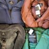 The photo shows a package with clothing in the category TJ.